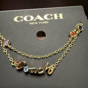 NWT Coach Signature Script Necklace in gold multi-color stones dainty logo